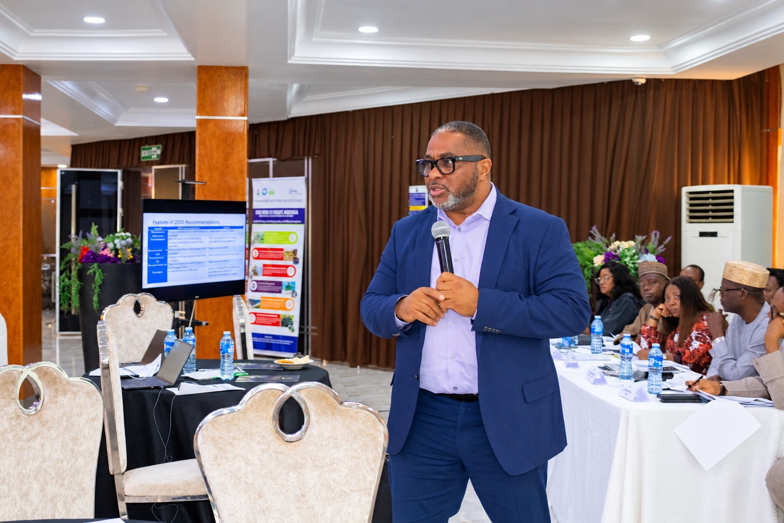 Franklin Ibemessie presenting to procurement workshop participants